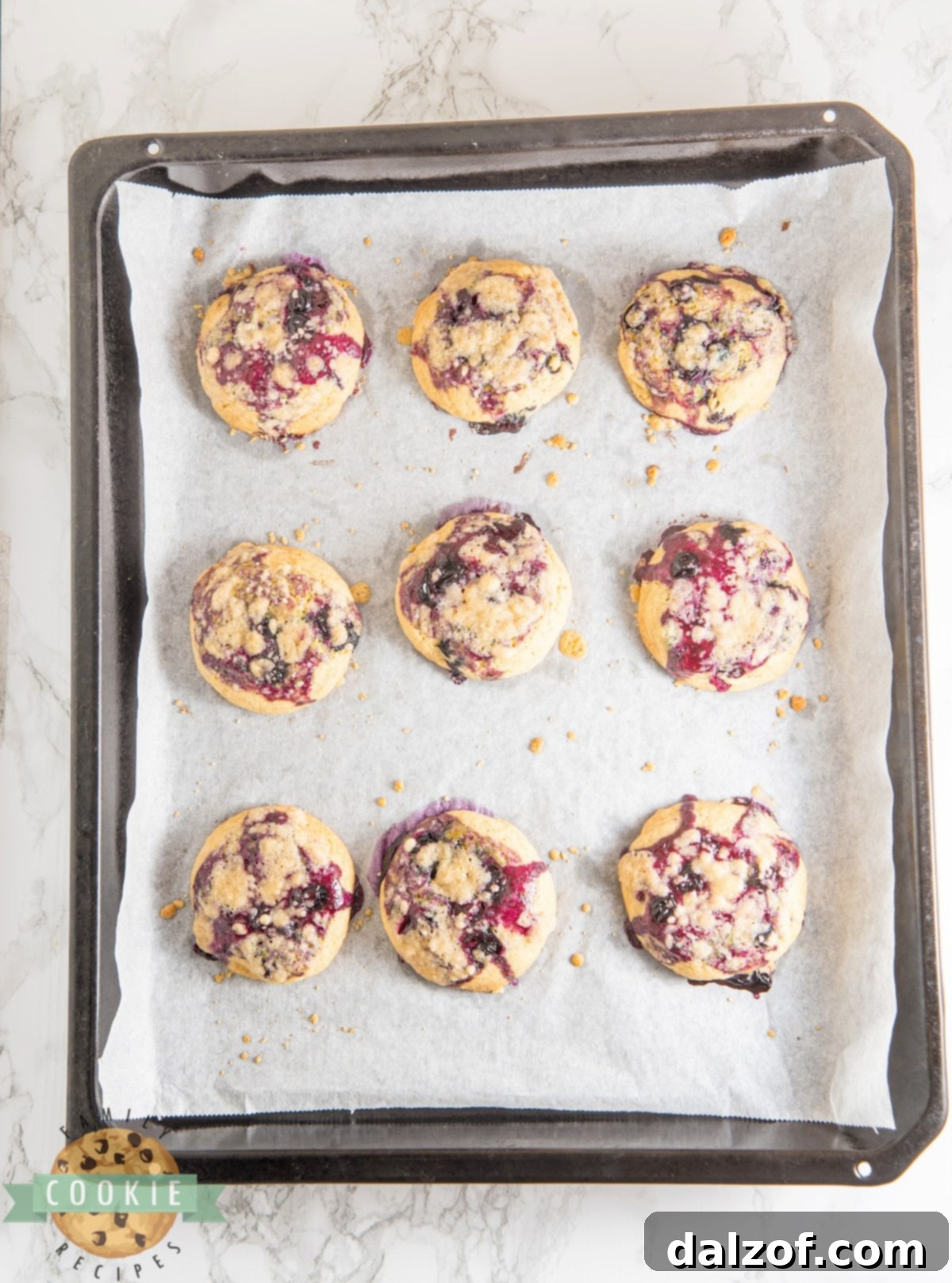 Close-up of perfectly baked blueberry muffin cookies with a golden streusel topping.