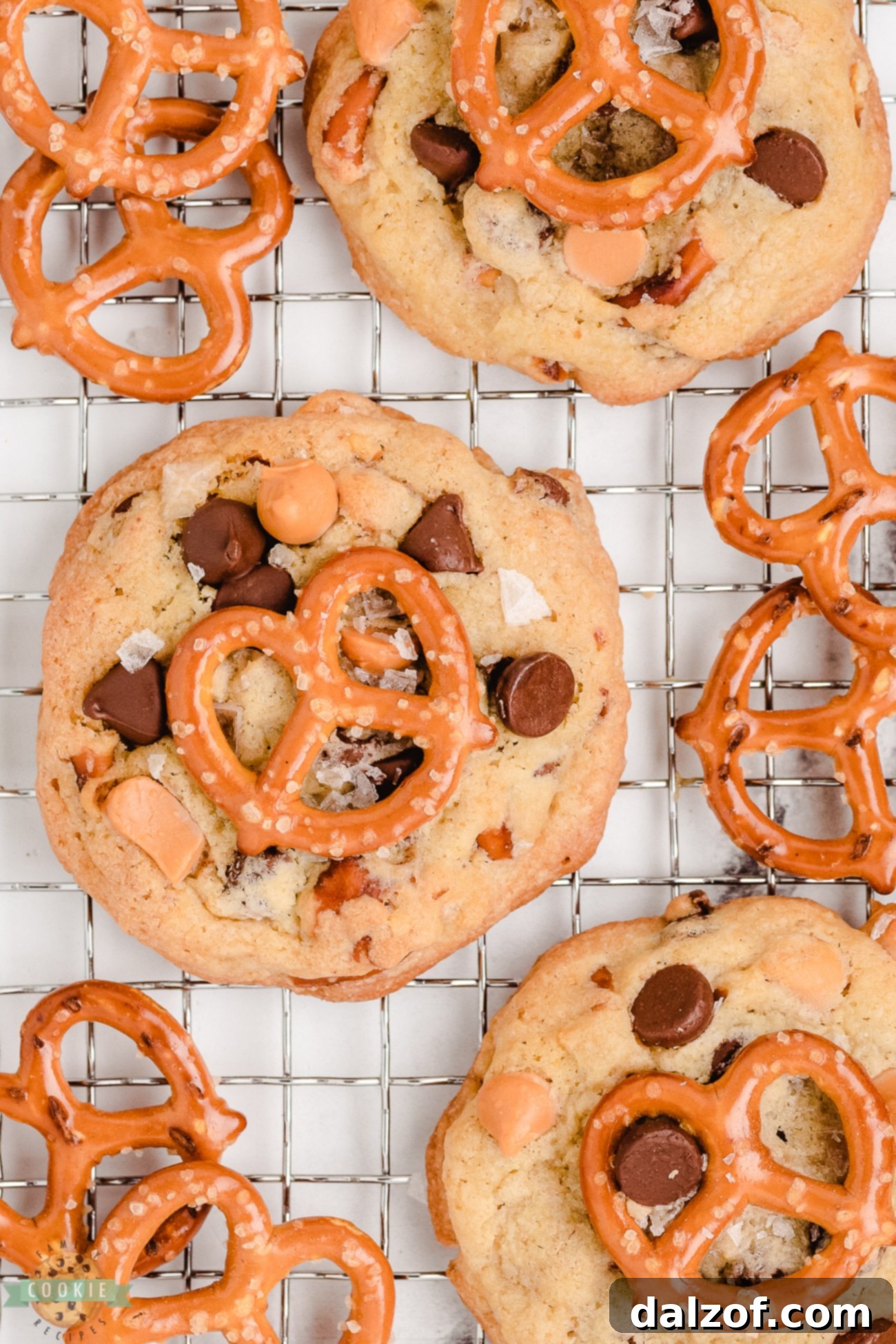 Freshly baked butterscotch pretzel cookies cooling on a wire rack