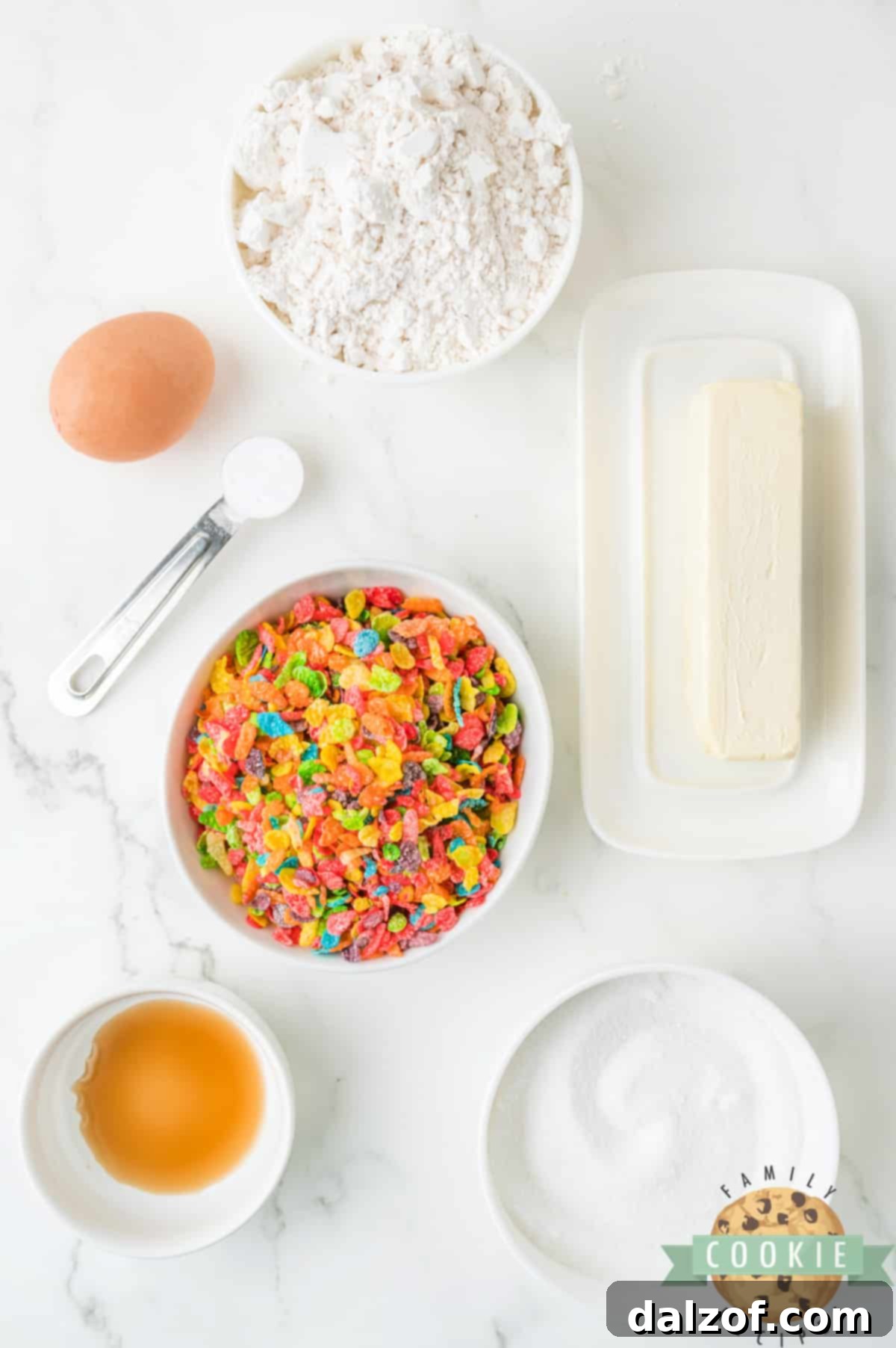 Various ingredients for Fruity Pebbles Cookies laid out on a counter.