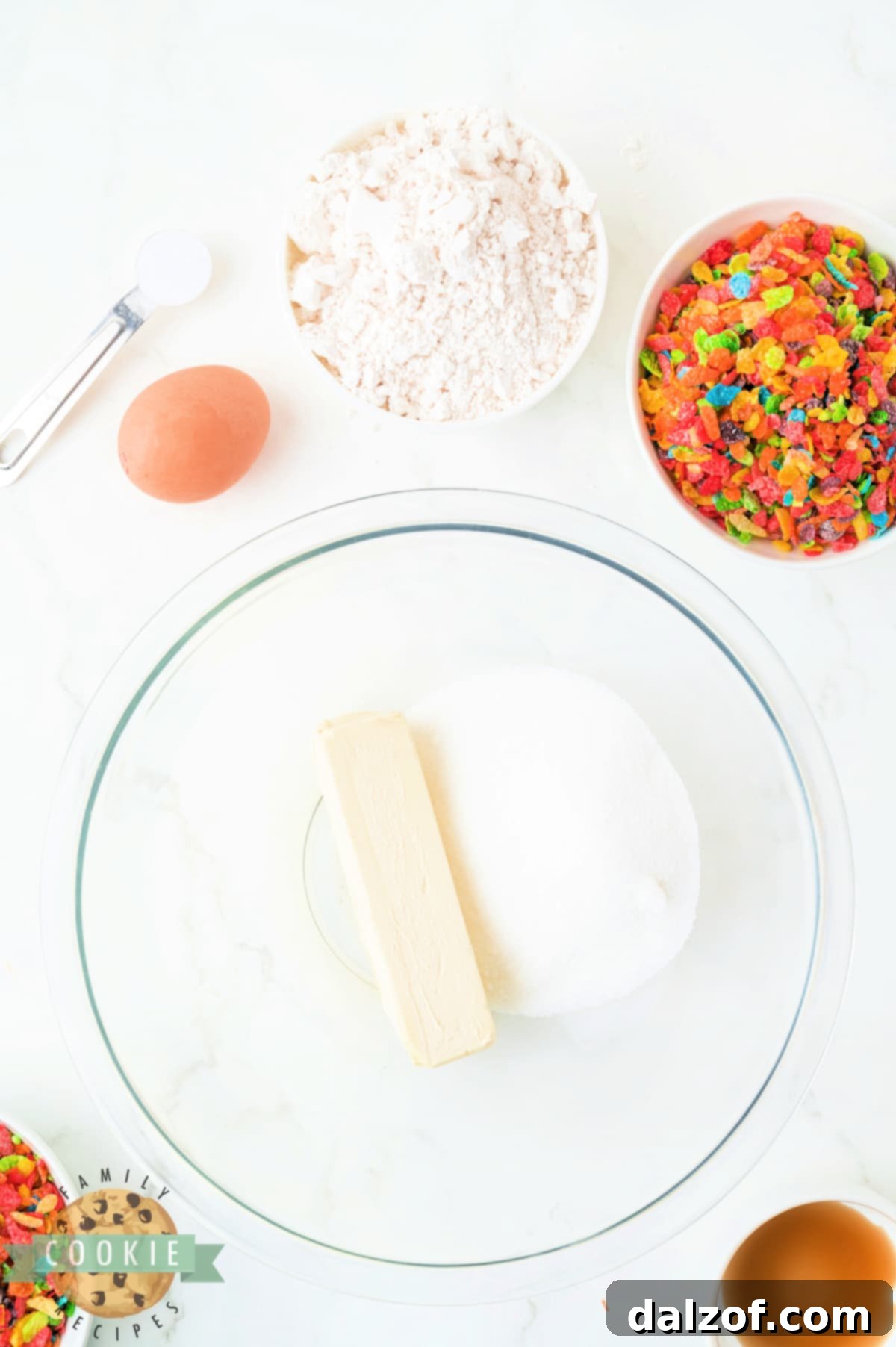 Creaming butter and sugar in a bowl with an electric mixer.
