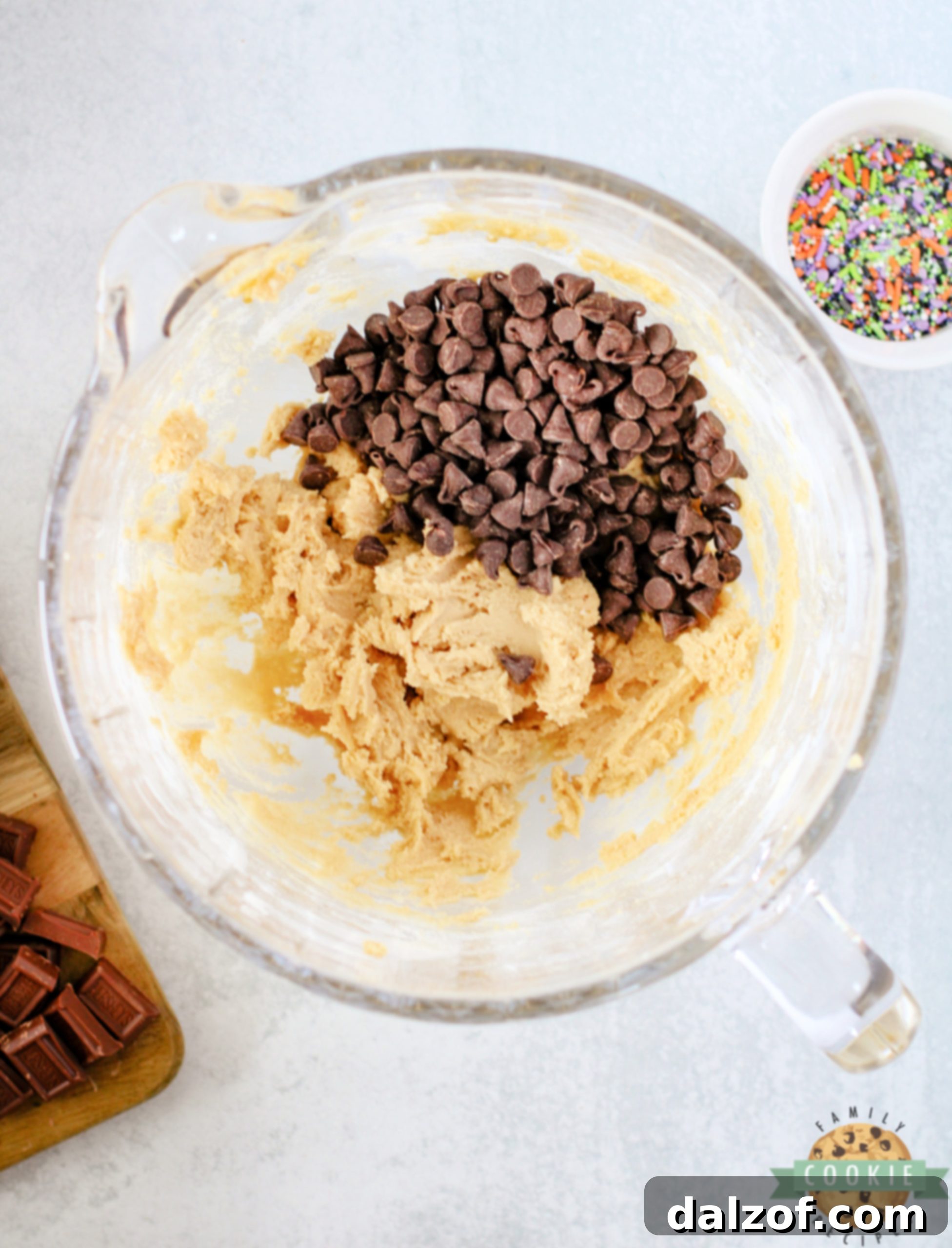 Add chocolate chips to cookie dough.