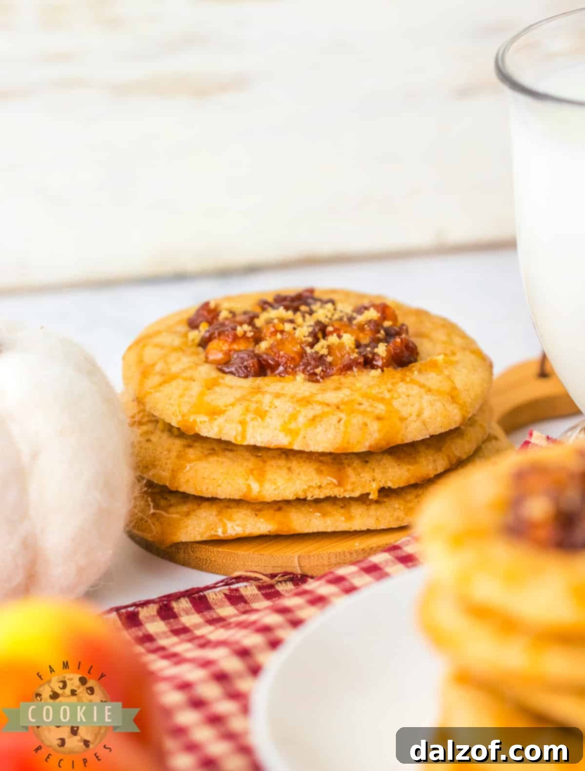 Spiced Apple Thumbprint Cookies are soft cinnamon cookies with gooey, spiced apples on top. Drizzle caramel on top and serve these delicious apple cookies with a scoop of vanilla ice cream!