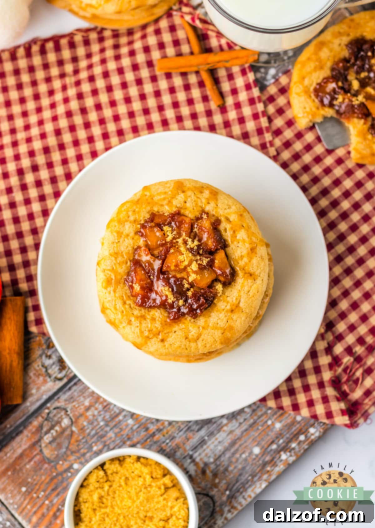 Spiced Apple Thumbprint Cookies are soft cinnamon cookies with gooey, spiced apples on top. Drizzle caramel on top and serve these delicious apple cookies with a scoop of vanilla ice cream!