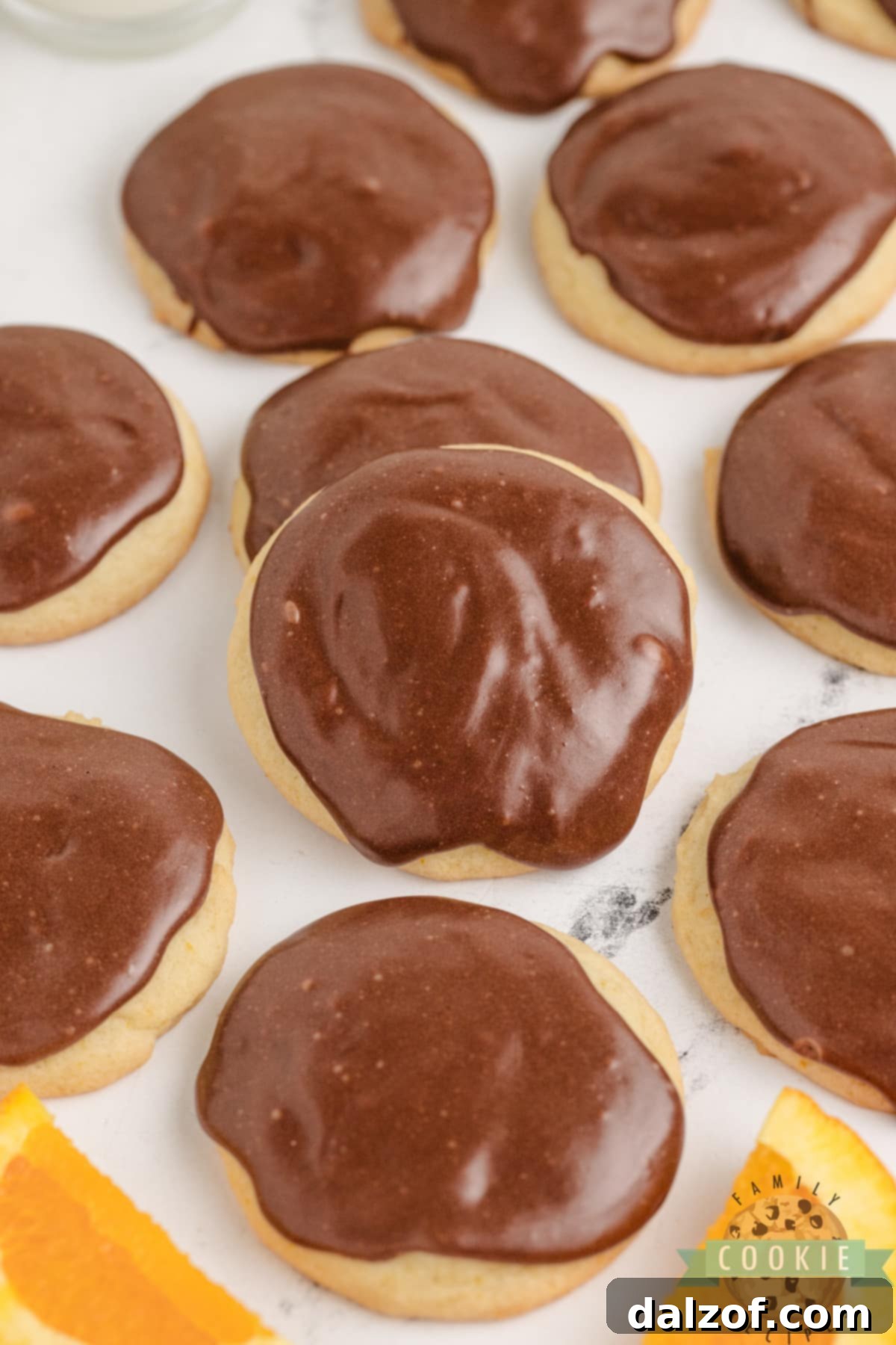 Thick orange cookies with fudge topping. 