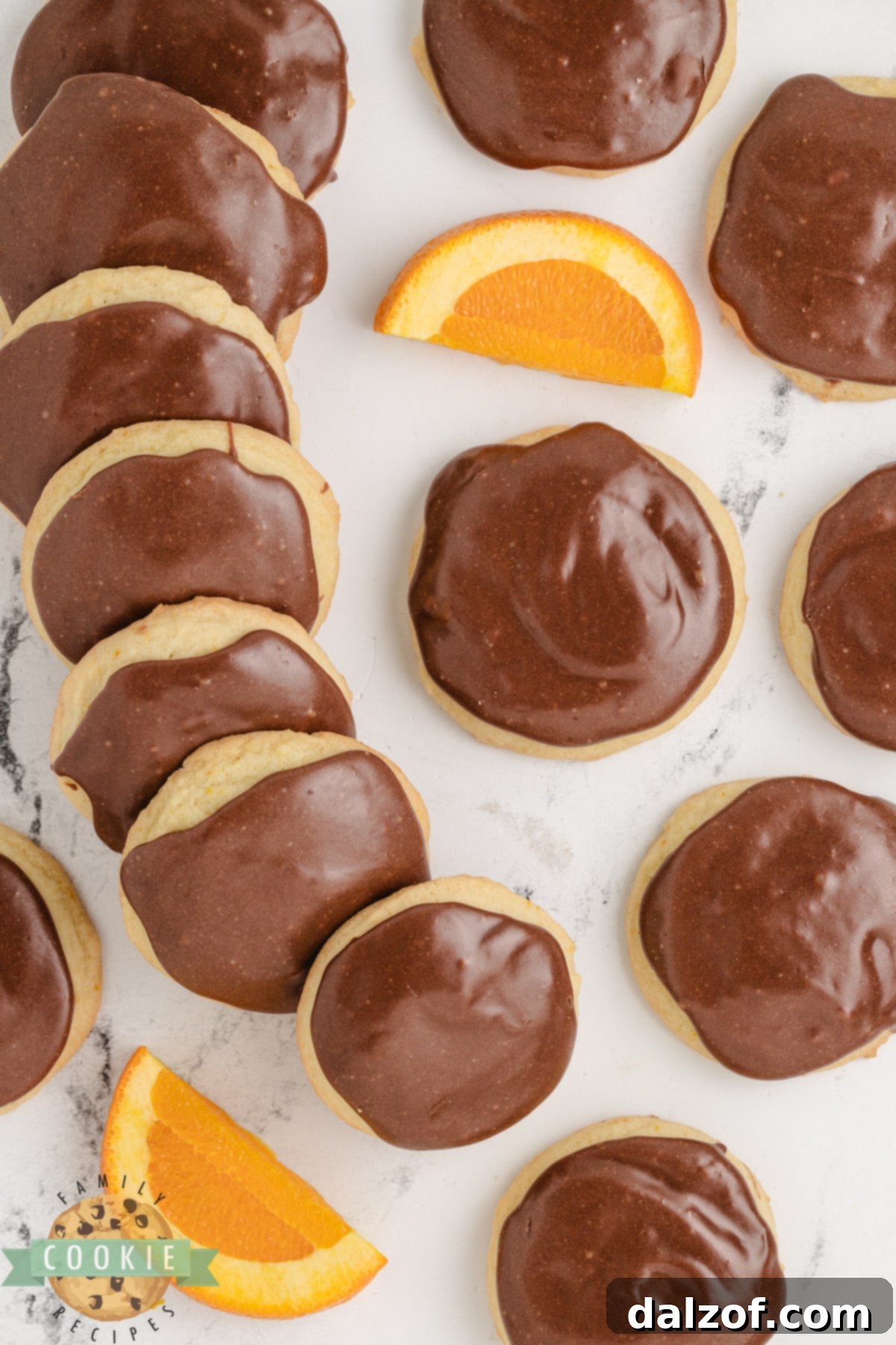 Fudge Topped Orange Cookies are soft, chewy orange cookies that are topped with a rich and creamy fudge topping. Delicious cookies made with the perfect combination of chocolate and orange.