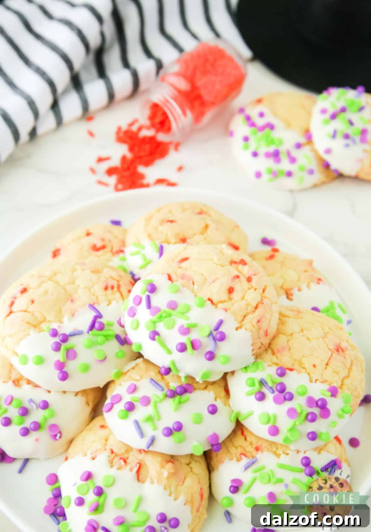 A selection of Halloween Cake Mix Sprinkle Cookies, beautifully decorated with various sprinkles, arranged for a festive display.