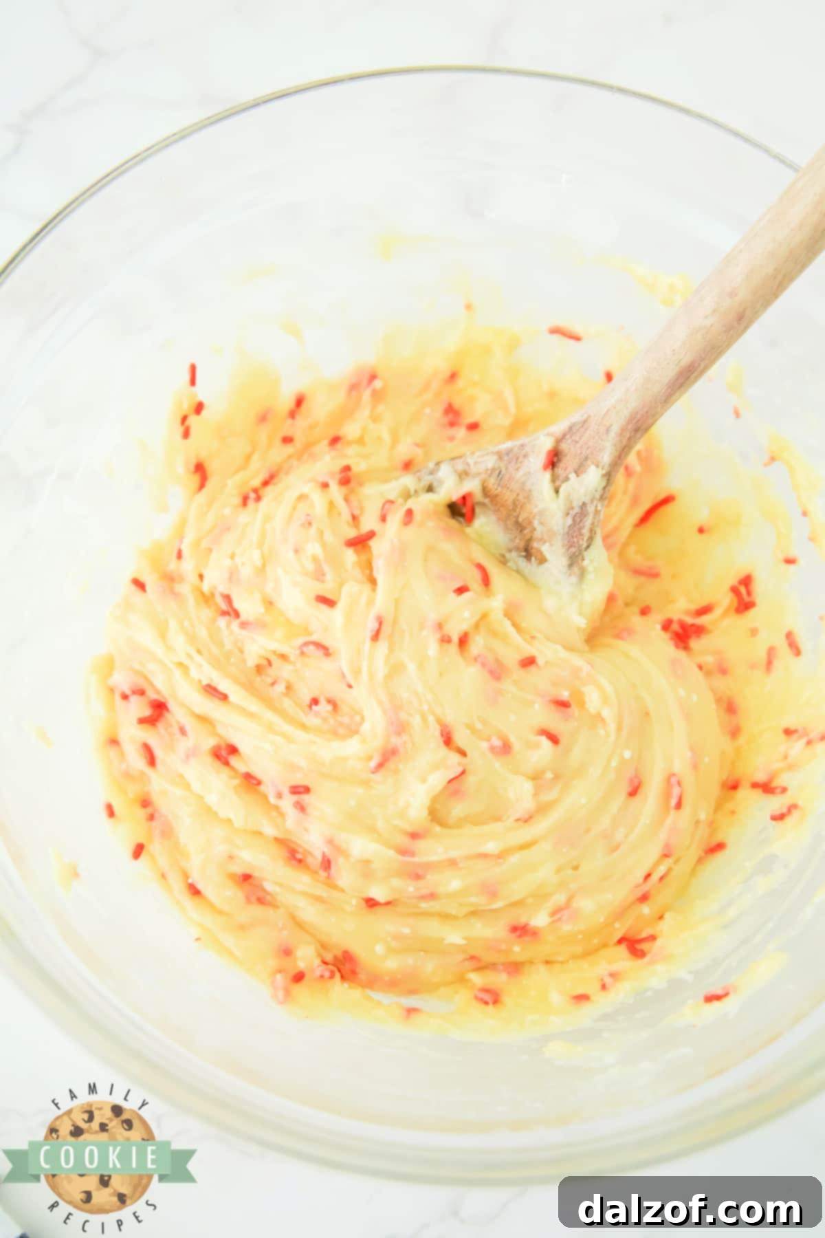 Close-up of the perfectly mixed cake mix cookie dough, showcasing its smooth texture and embedded sprinkles.