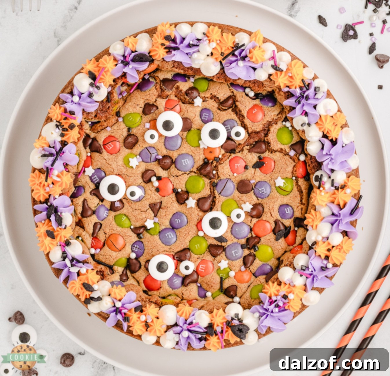 Halloween cookie pie with frosting and sprinkles on top