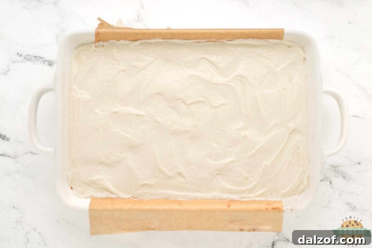 Spread cream cheese over cooled cookie bars. 