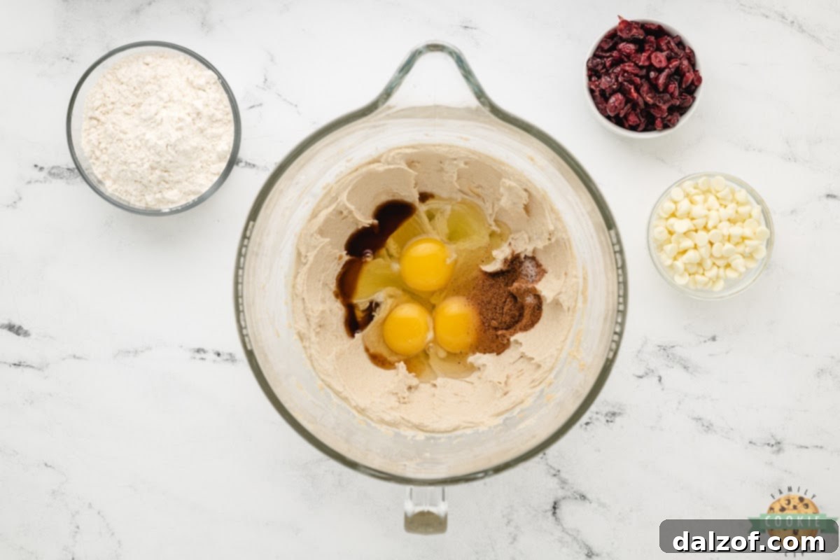 Add eggs, vanilla, and nutmeg to the creamed butter mixture.