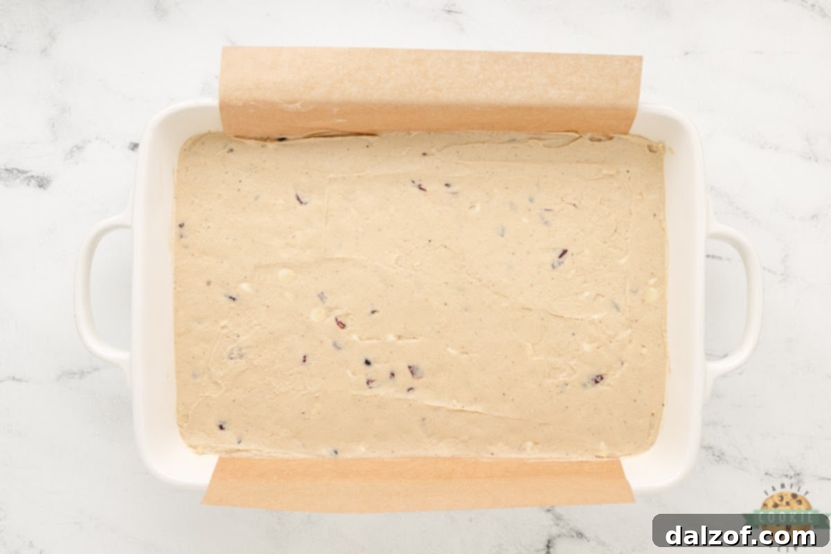 Spread cookie dough in a 9X13 lined with parchment paper.