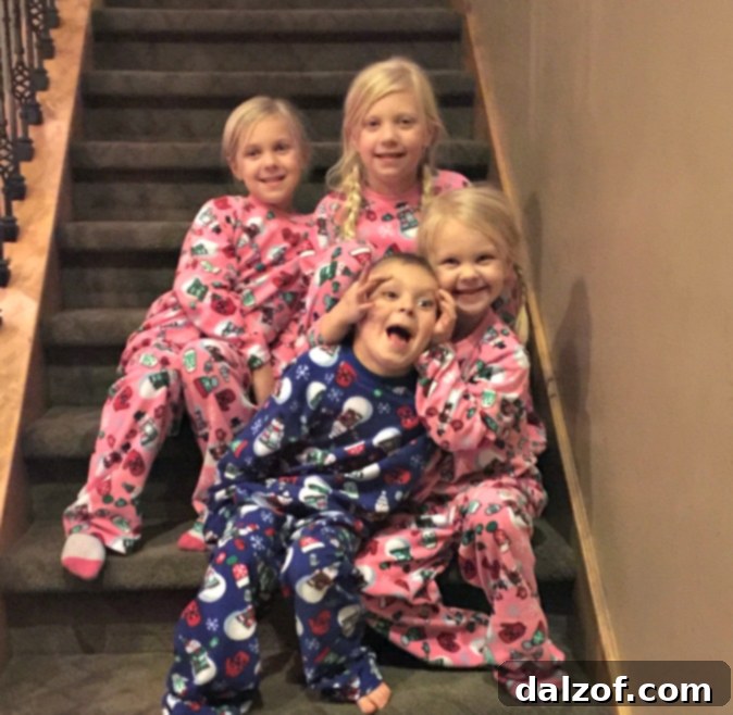 Family Christmas morning photo on the stairs