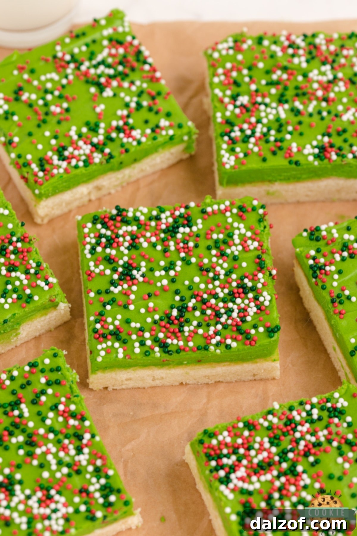 Thick and soft sugar cookie bars with festive sprinkles