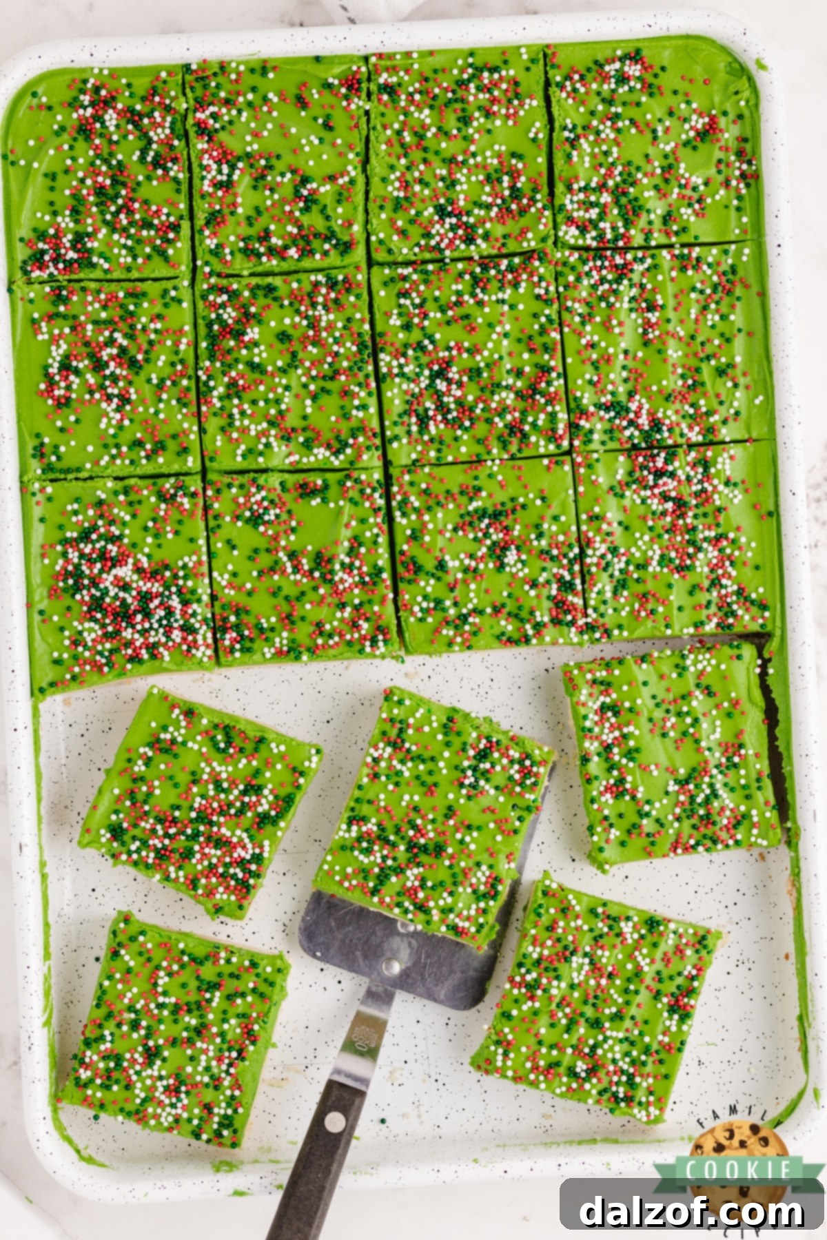 Sliced Christmas sugar cookie bars decorated with sprinkles