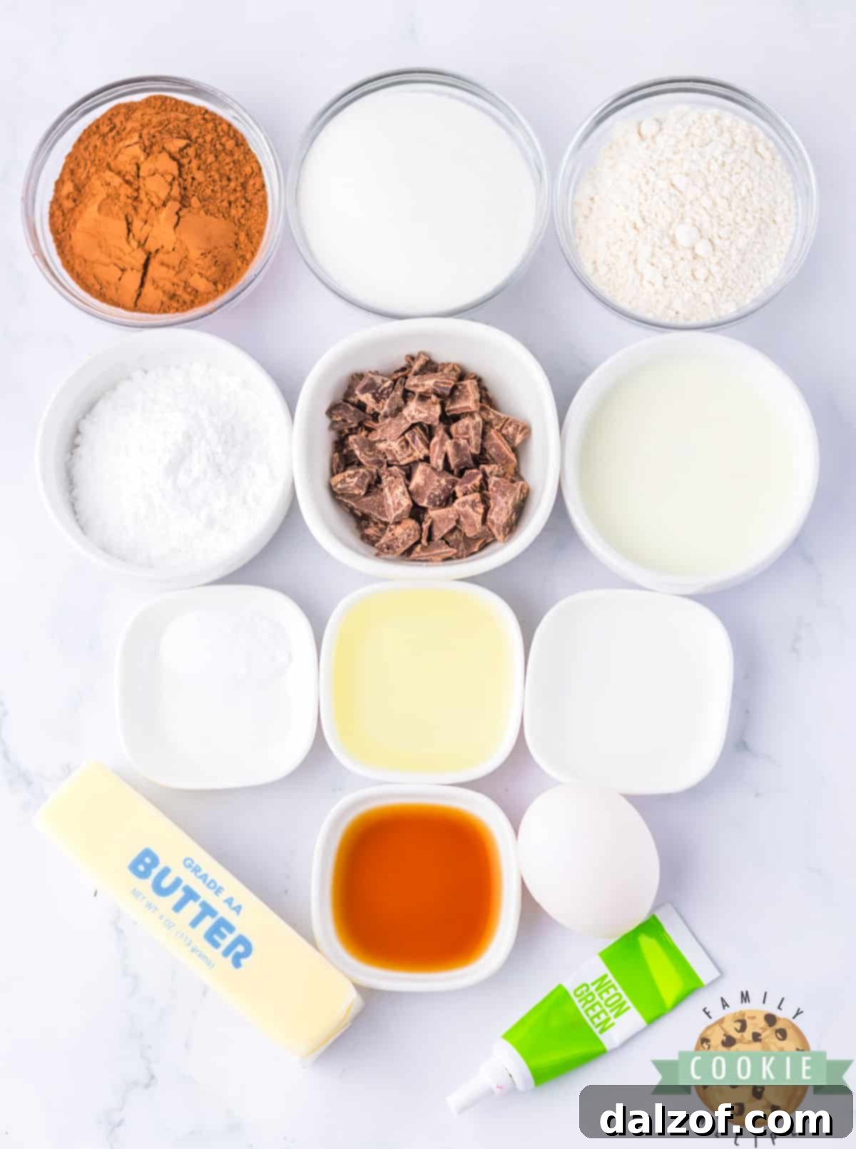 All the essential ingredients for making Frosted Mint Chocolate Cookies, neatly arranged on a kitchen counter.