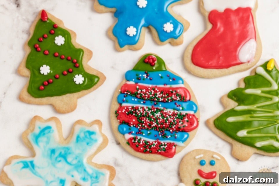 Classic Christmas Cut-Out Cookies perfect for the holidays! Easy sugar cookies for cookie cutters with a simple shiny cookie icing that everyone loves.