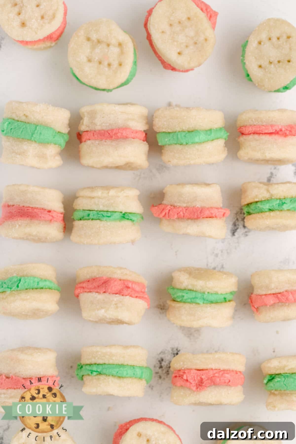A delightful close-up of finished Mini Christmas Sandwich Cookies, showcasing their charming size and festive frosting.