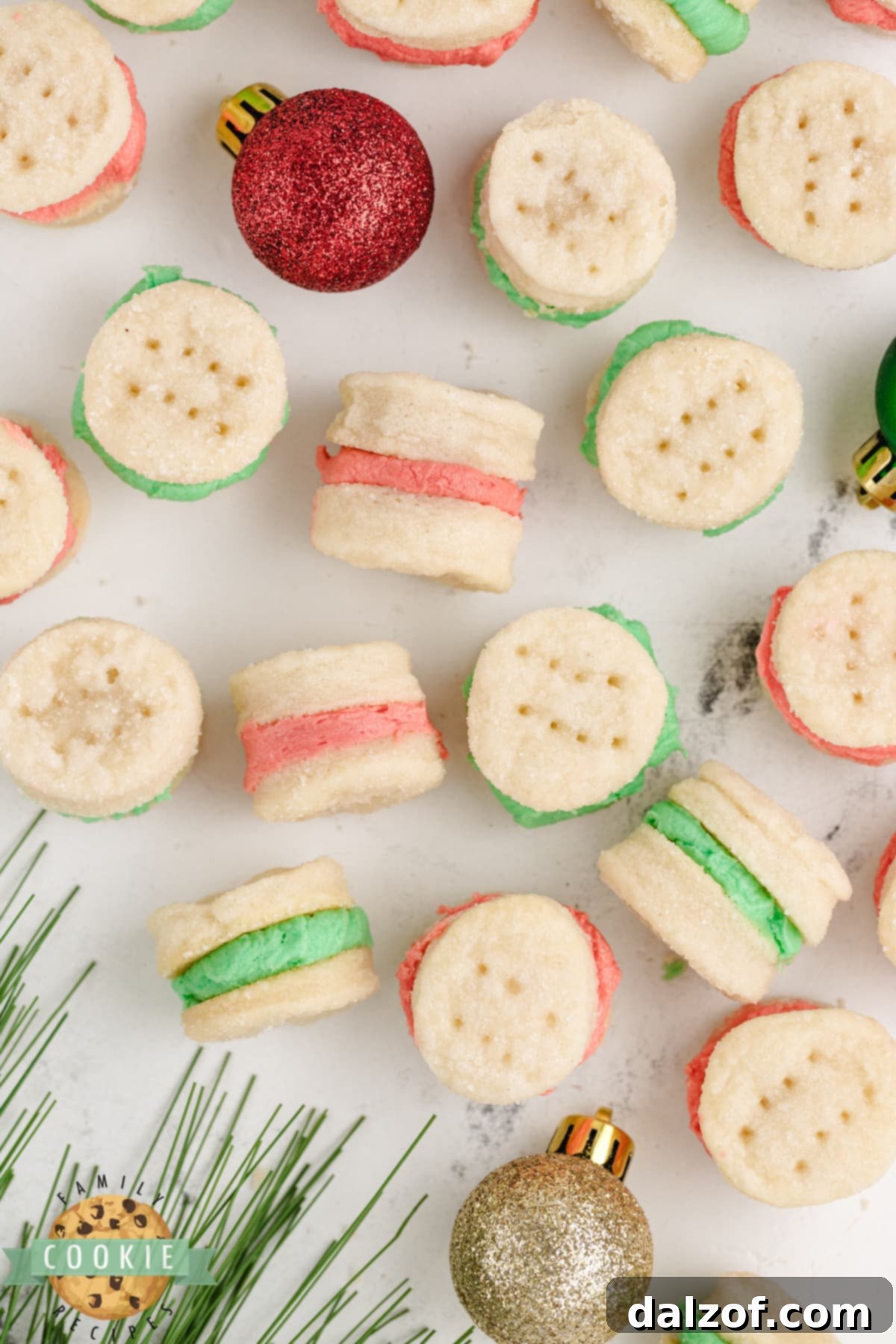 An array of Mini Christmas Sandwich Cookies, featuring both red and green frosting, ready for holiday festivities.