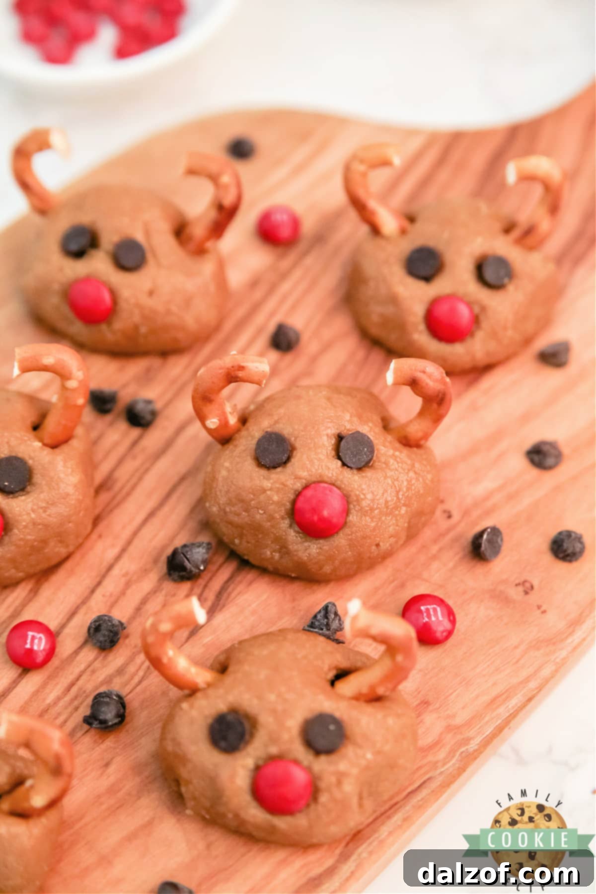 Rudolph's Red-Nosed Cookie Butter Delights 5 Delicious no-bake holiday treats: Rudolph Cookie Butter Balls arranged on a festive platter.