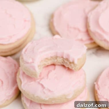 soft cream cheese sugar cookies with pink frosting