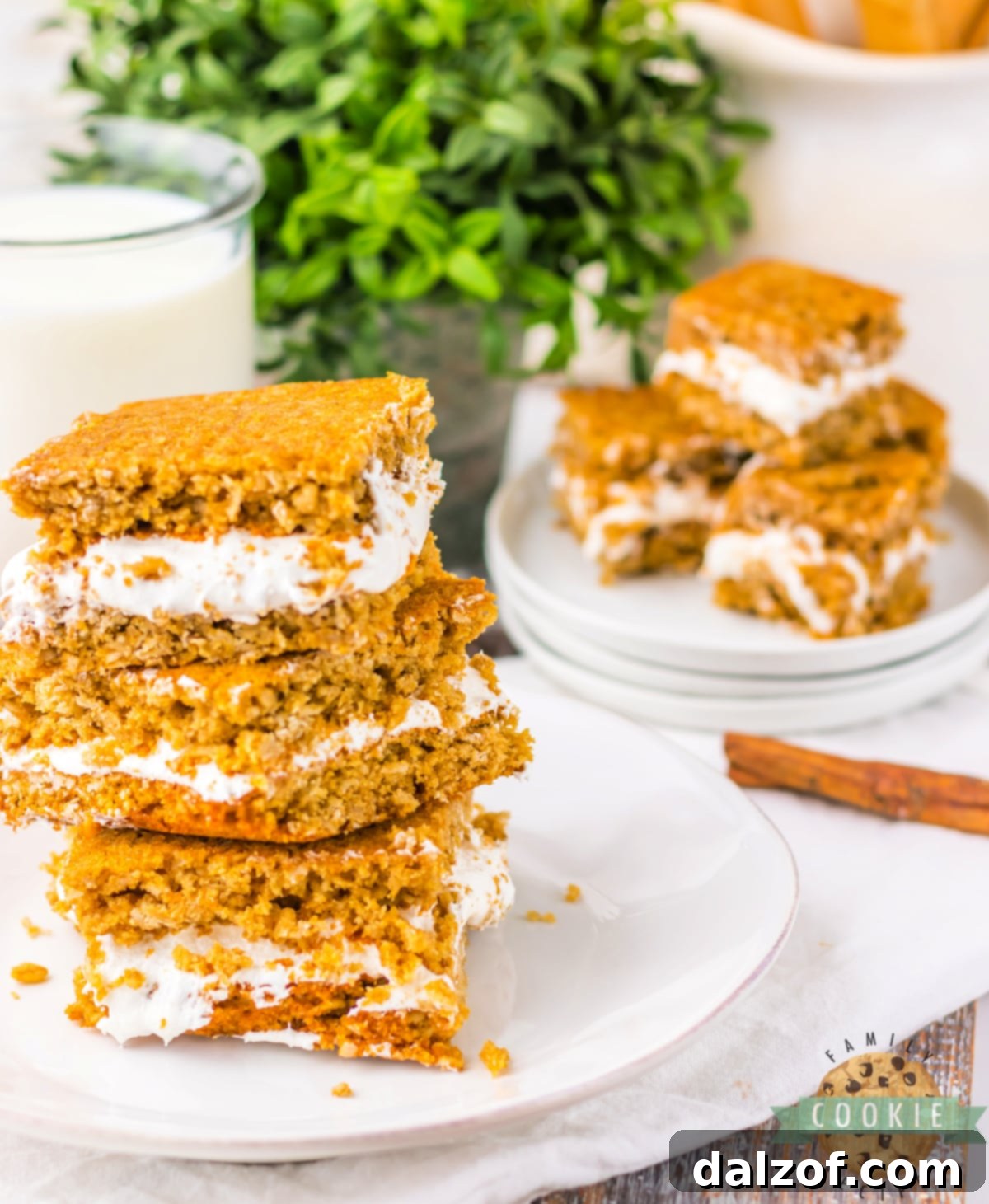 Close-up of soft and chewy Oatmeal Cream Pie Bars with marshmallow cream filling, just like the classic Little Debbie snack.