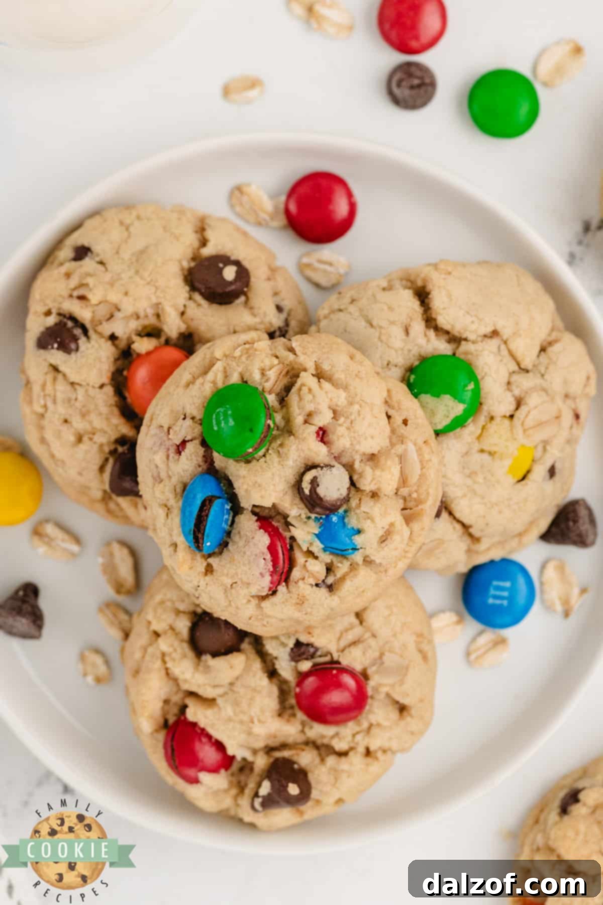 Close-up of baked 5-Ingredient Monster Cookies, showing off the rich mix of chocolate, peanut butter, and M&Ms.