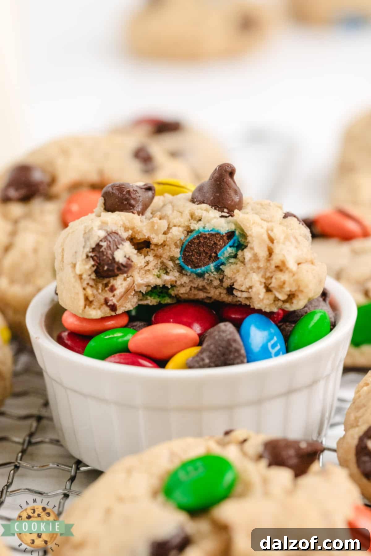 A finished batch of easy 5-Ingredient Monster Cookies on a cooling rack, showcasing their delicious texture and colorful toppings.