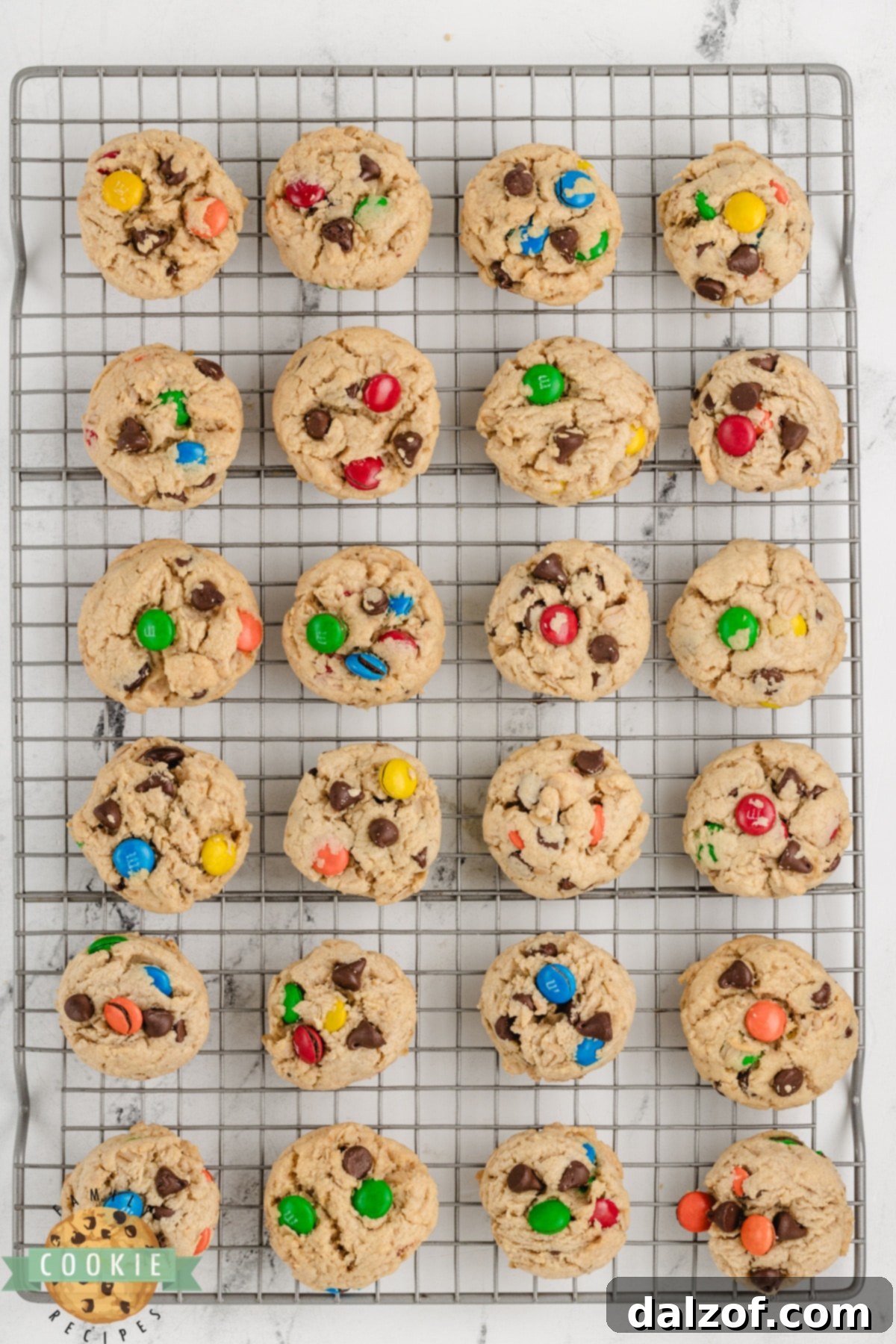 Baked 5-Ingredient Monster Cookies cooling on a wire rack after being removed from the baking sheet, ensuring optimal texture.