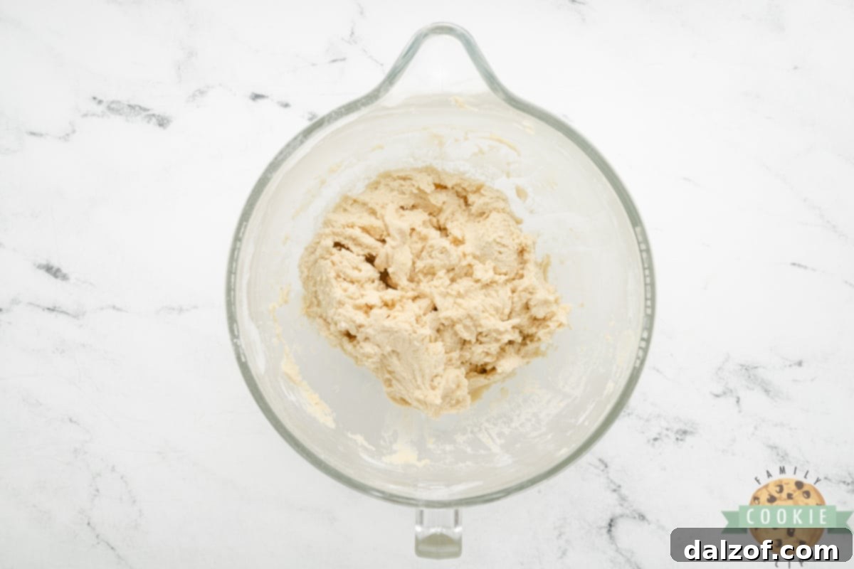 Unmixed sugar cookie dough in a bowl, ready to be prepared for the Braided Sweetheart Cookies.