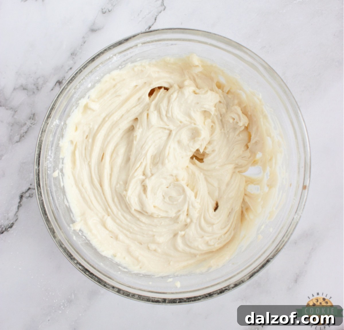 Beat the mascarpone frosting.
