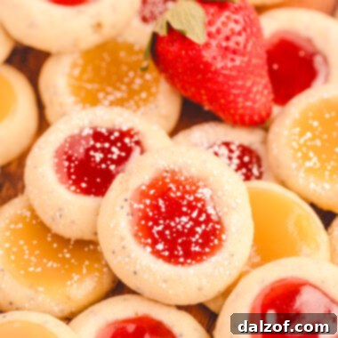 poppy seed thumbprint cookies filled with strawberry jam and lemon curd