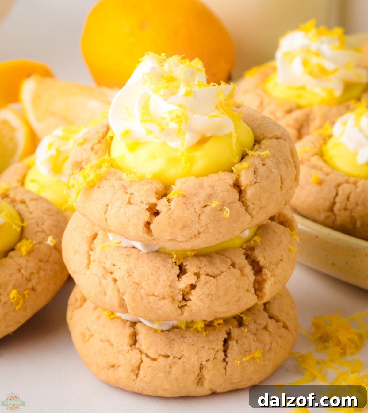 stacked lemon pie cookies, showcasing their layers of buttery cookie, lemon pudding, and whipped cream