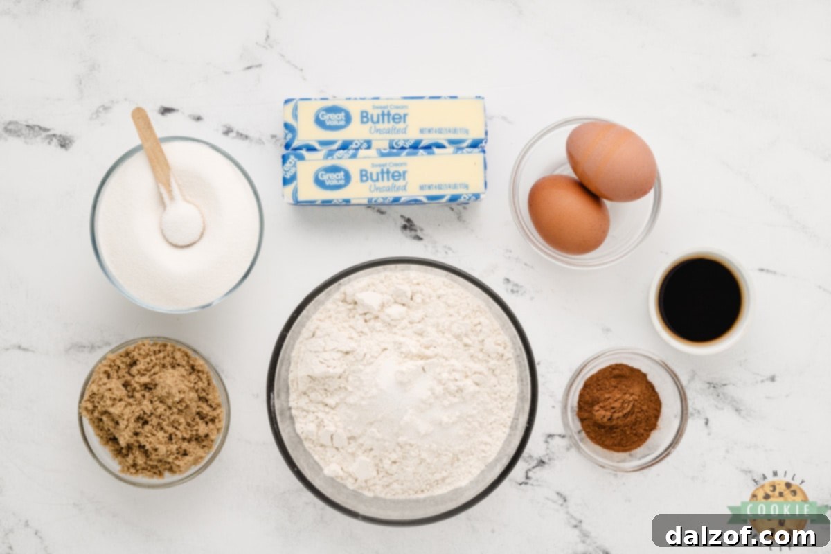 A selection of the key ingredients used to make soft and chewy Snickerdoodle Cookie Bars, including butter, sugars, and flour.