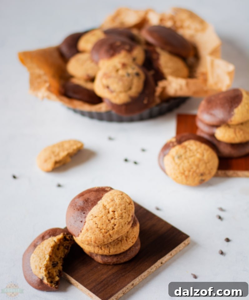 Close-up of freshly baked Brookies cookies with visible brownie and chocolate chip cookie layers.