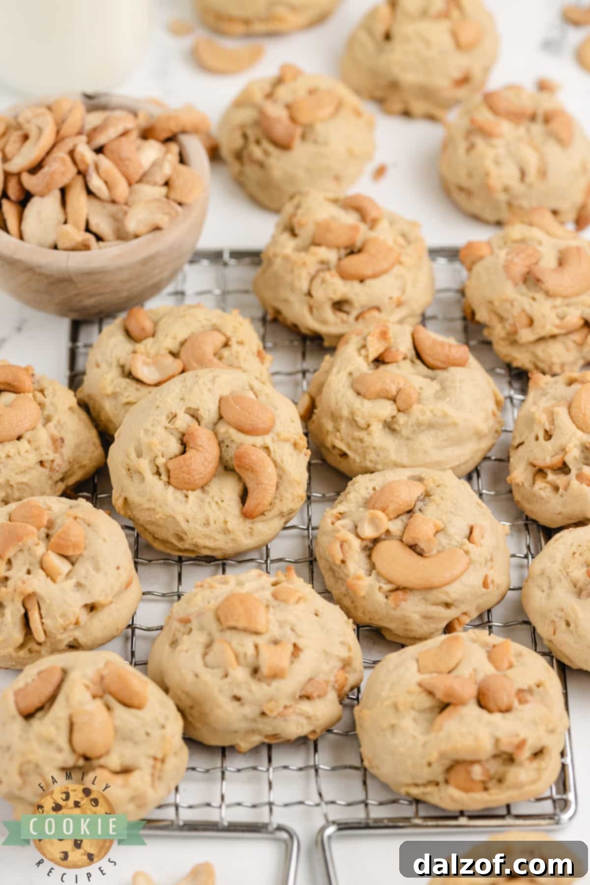A stack of golden brown Cashew Cookies, emphasizing their rich texture and appeal, ready for enjoyment.