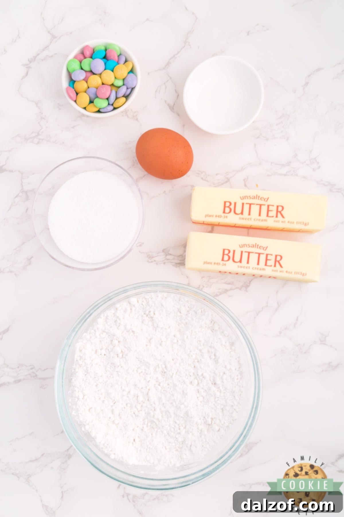 All the essential ingredients for Spring Spritz Cookies laid out, highlighting their simplicity.