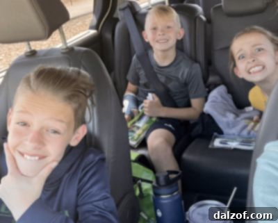 A proud mom with her children celebrating a cavity-free dental checkup, maybe with cookies!