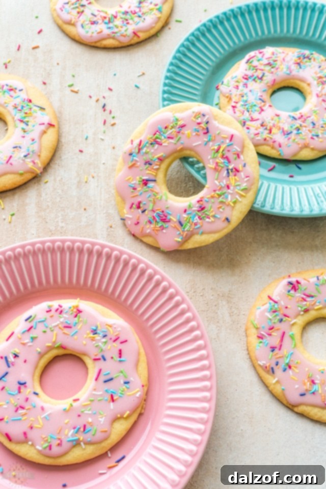 Pink Donut Cookies cooling on a rack, ready for glazing