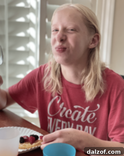 Teenager holding waffles