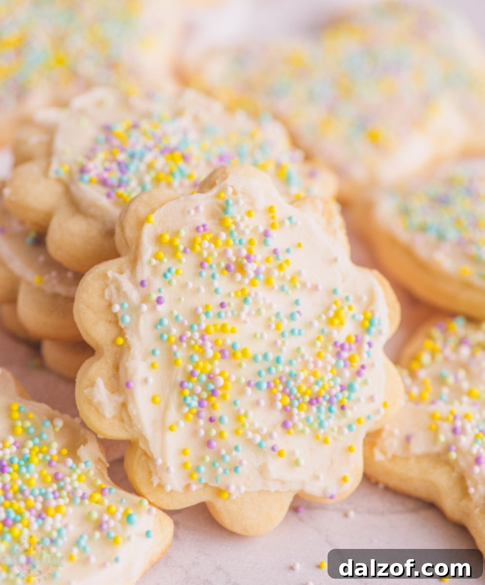 Decorated butter sugar cookies with vanilla frosting and sprinkles