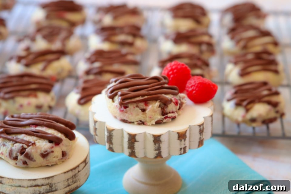 Another perspective of Chocolate Raspberry Cheesecake Cookies on a cooling rack.