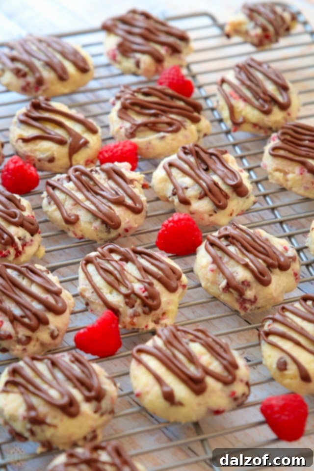 Finished Chocolate Raspberry Cheesecake Cookies stacked on a serving plate.