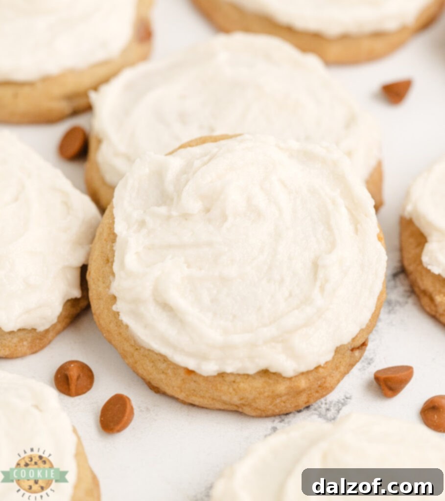A plate of freshly baked Iced Cinnamon Chip Cookies, soft, chewy, and generously frosted with creamy vanilla icing.
