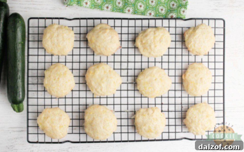 A stack of perfectly glazed Lemon Zucchini Cookies, ready to be enjoyed