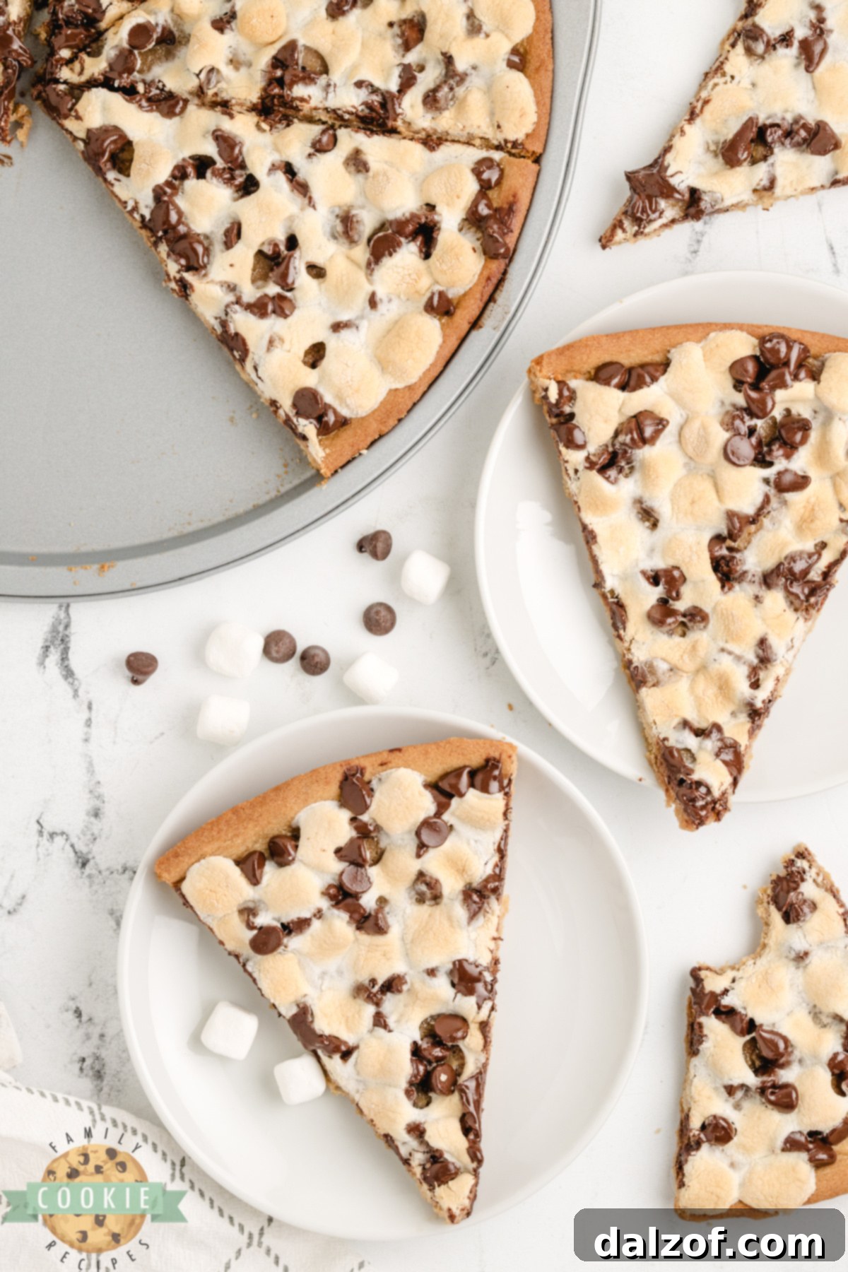 Peanut Butter Cookie Pizza is chewy, gooey, and loaded with marshmallows and chocolate. A fast, fun dessert everyone will love!