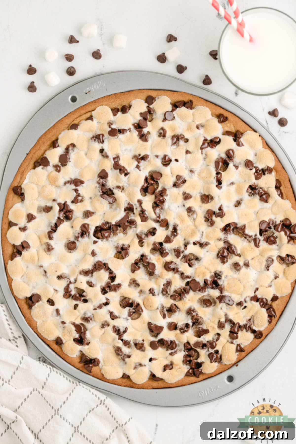 Peanut Butter Cookie Pizza is chewy, gooey, and loaded with marshmallows and chocolate. A fast, fun dessert everyone will love!