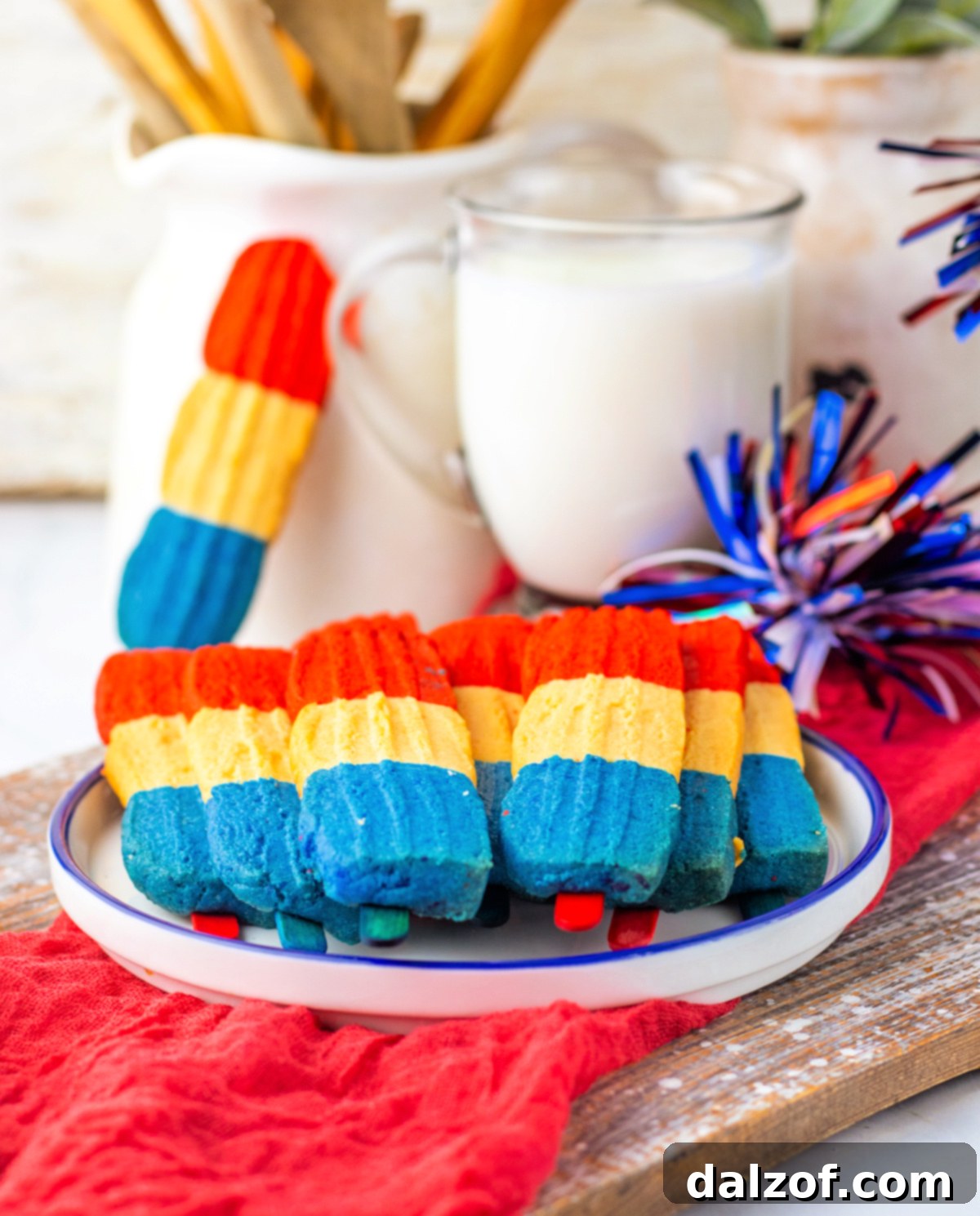 These festive Bomb Pop Cookies are soft, colorful, and packed with classic cherry and berry flavors. Perfect for summer parties and 4th of July!