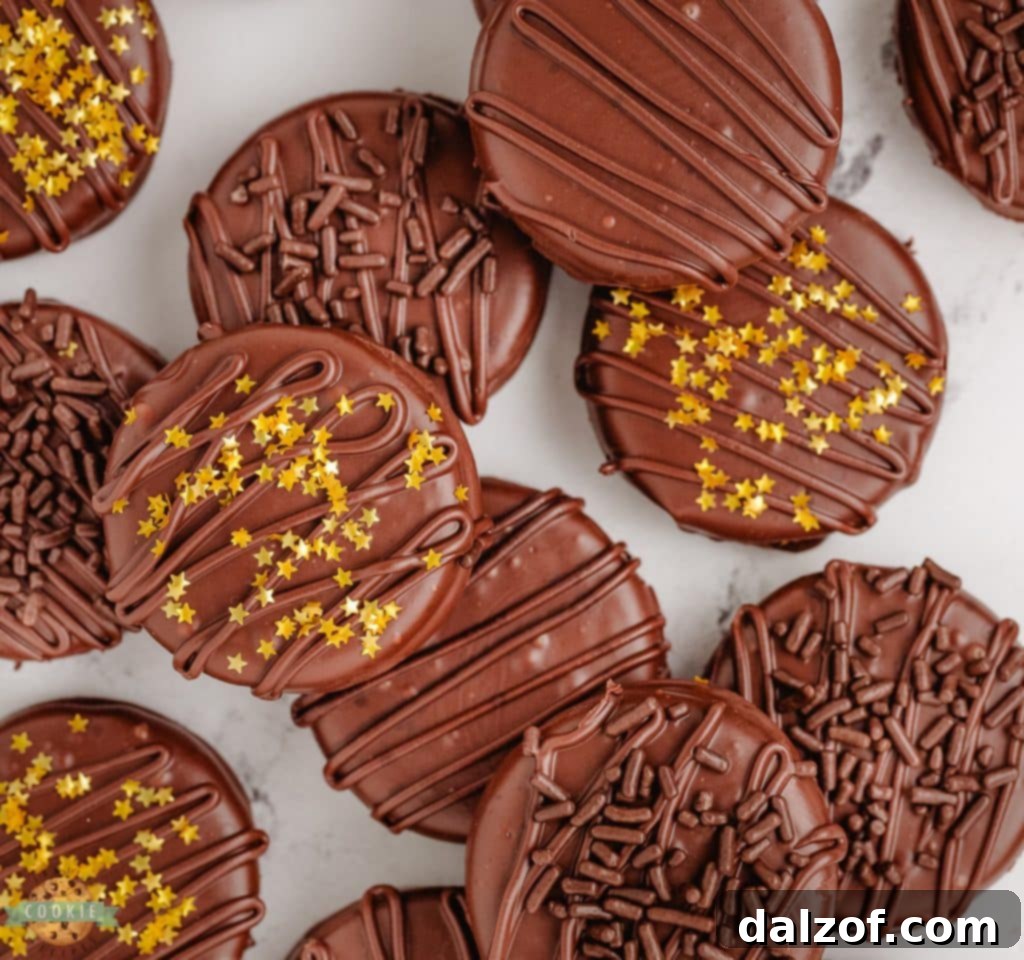 Decadent Chocolate Dipped Oreos, beautifully garnished with chocolate sprinkles.