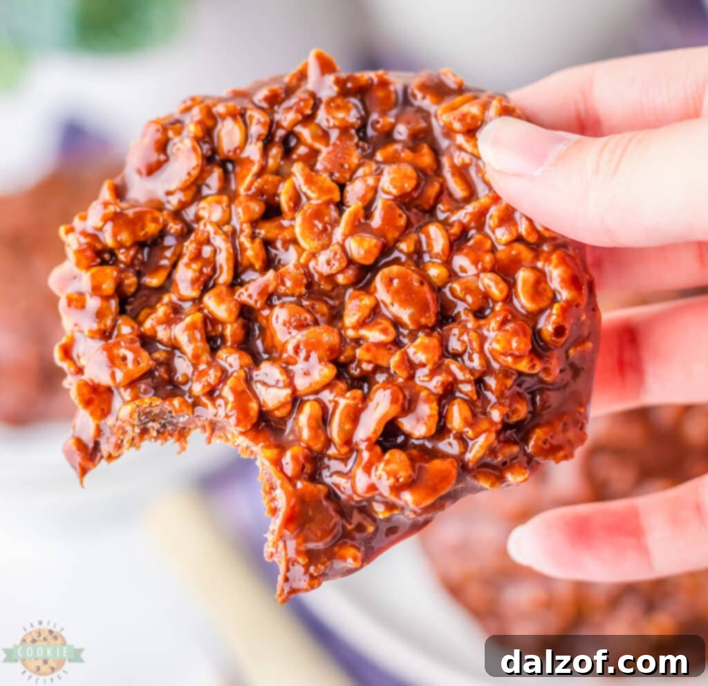 Holding a copycat Star Crunch cookie, showing its characteristic bumpy top.