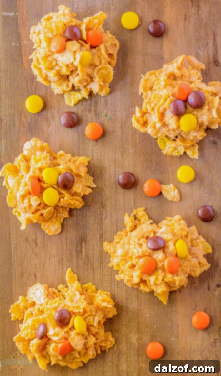 A selection of no-bake cornflake cookies artfully arranged on a rustic wooden board